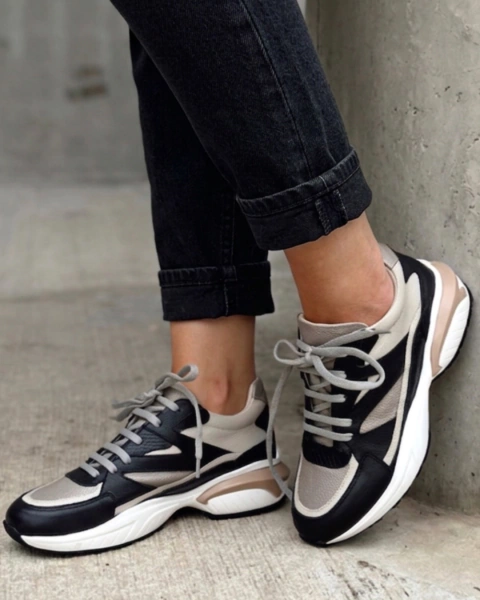 Sneakers de cuero modelo Thunder Moon en tonos negro, beige y blanco, con diseño moderno