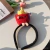 Kit C/12 Tiara com Pelúcia com mãozinha Batata frita - comprar online