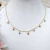 Choker4 bolinhas azuis e 4 mini corações banhada a ouro 18K na internet