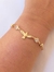 PULSEIRA DIVINO ESPIRITO SANTO COM PONTOS DE LUZ BANHADA A OURO 18K