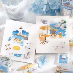 Cintas decorativas PET Now Go Series con motivos marinos y costeros, incluyendo barcos, faros, mesas al aire libre y paisaje costero