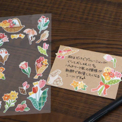 Plancha de stickers con diseños de flores, un pajarito y un conejo