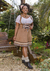Transforme-se com o Traje Blume Conhaque! Conforto e estilo em corpete com suspensórios e saia fluída. Descubra nossas blusinhas e arrase na sua produção!