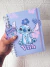 Caderno A5 pautado Stich lilás na internet
