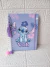 Caderno A5 pautado Stich lilás