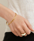 PULSERA ADELE ORO en internet