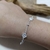 PULSERA MARIPOSA Y FLOR en internet