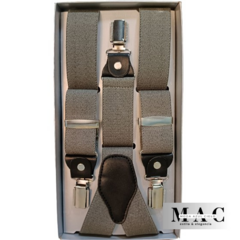 Tirantes gris en caja, con clips metálicos y detalles de cuero.