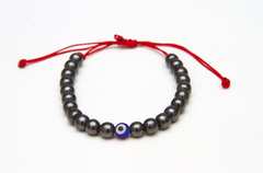 Pulsera Hematite con ojito - Milagros de la Abuela