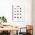 Quadro decorativo mostrando diferentes tipos de café, incluindo espresso, macchiato e latte, em uma cozinha moderna.