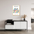 Quadro decorativo "Matisse, The Garden" com ilustrações coloridas de folhas em um ambiente moderno.