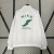 Jaqueta Corta-Vento Nike Branca Com Detalhes Em Verde - comprar online