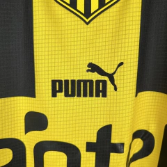 Camisa Peñarol Edição Especial Aniversario 23/24 - Torcedor Puma Masculina - Preta e amarela com detalhes em branco - tienda online