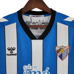 Camisa Málaga I 22/23 - Torcedor Hummel Masculina - Azul com detalhes em branco e preto on internet