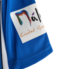 Camisa Málaga I 22/23 - Torcedor Hummel Masculina - Azul com detalhes em branco e preto - Skull Sports