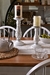 Portavela / Candelabros de vidrio, color blanco. Dos medidas.  Chico: 23 cm de alto x  11.50 de ancho.  Grande: 31 cm de alto x 12 cm de ancho.