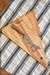 MATERIAL: Madera de leuka compensada.  MEDIDAS: 40cm. X 27cm. X 18mm.  PESO: 652 gr.  ELEMENTOS (2 PIEZAS):  1 Tabla de queso triangular mediana Nro.2. 1 Cuchillo de degustación con hoja 12cm. acero quirúrgico perforada y punta tenedor con mango madera de
