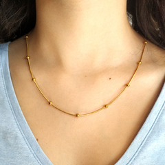 Collar Abril acero dorado
