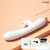 Vibrador Ponto G recarregável na cor branca, com design moderno e cabo de carregamento.