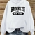 Blusa Feminina Casual Brooklyn NYC Capuz e Bolso ElaShopp - ElaShopp.com