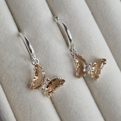 AROS ACERO BLANCO CON MARIPOSA CRISTALES AMBAR CHAMPAGNE K7207