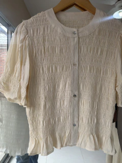 Blusa bruna en internet