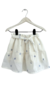 Pollera Bruma de gasa color off white bordada con flores en color plateado. 