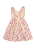 Vestido de gasa de algodón natural estampada con diseño exclusivo. Tiene volados en breteles y aplique de moño en la espalda. 