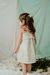 Nena con vestido Nacar, rayado con lurex, y detalle de broderie en pechera