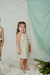 Nena con vestido Nacar, rayado con lurex, y detalle de broderie en pechera