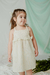Nena con vestido Nacar, rayado con lurex, y detalle de broderie en pechera