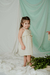 Nena con vestido Nacar, rayado con lurex, y detalle de broderie en pechera