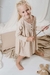 Nena con vestido savernake, de algodon estampado en beige con rosa