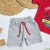 Remera Palmeras + Short Rojo en internet