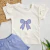 Remera moño + Short Lila - comprar online