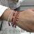 PULSERA BOLITAS CRISTAL RED DOS Y UNA DE ACERO BLANCO en internet
