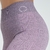 Calça legging feminina rosa mescla da marca Marcio May Sports, destacando o detalhe do cós e o padrão do tecido.