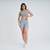 Modelo usando top feminino cinza mescla Marcio May, ideal para atividades fitness.