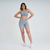 Modelo usando shorts feminino cinza mescla da Marcio May Sports, ideal para atividades físicas.