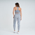 Modelo feminina usando calça legging cinza mescla da Marcio May Sports, vista de costas.