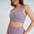 Top feminino rosa mescla para atividades de fitness, com alças largas e design confortável.