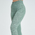 Calça legging feminina verde mescla da marca Marcio May Sports, ideal para atividades físicas.