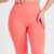 Calça legging feminina laranja Marcio May Sports Romilla, destacando o design e a textura do tecido.