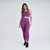 Calça legging feminina na cor uva, modelo Marcio May Sports Romilla, usada por uma mulher com cabelo ondulado, em um ambiente neutro.