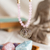 JAPA MALA DE CUARZO ROSA Y MADERA, AMULETO GANESHA - comprar online