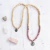 JAPA MALA DE RODONITA Y MADERA, AMULETO GANESHA - comprar online