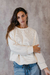 SWEATER CREAM TEJIDO CON CORDON en internet