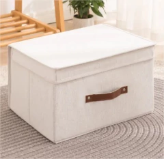 CAJA PLEGABLE "REMI" DE TELA "L" CON TAPA Y MANIJA DE CUERO