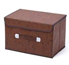 CAJA DE TELA CON TAPA Y MANIJA CON RELIEVE FLORES en internet