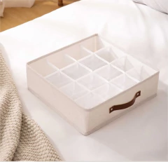 CAJA PLEGABLE "REMI" DE TELA 16 DIVISIONES CON MANIJA DE CUERO en internet